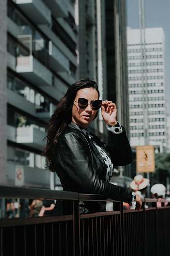 person woman leaning on metal handrail human