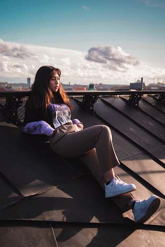 person woman leaning on roof human
