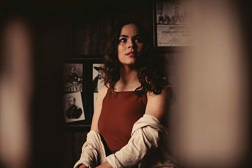 person woman sitting inside room during daytime human