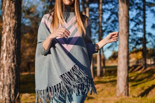 human woman standing surrounded by tress person