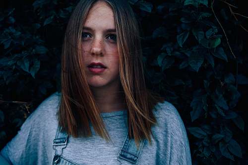 human woman wearing gray crew-neck t-shirt person