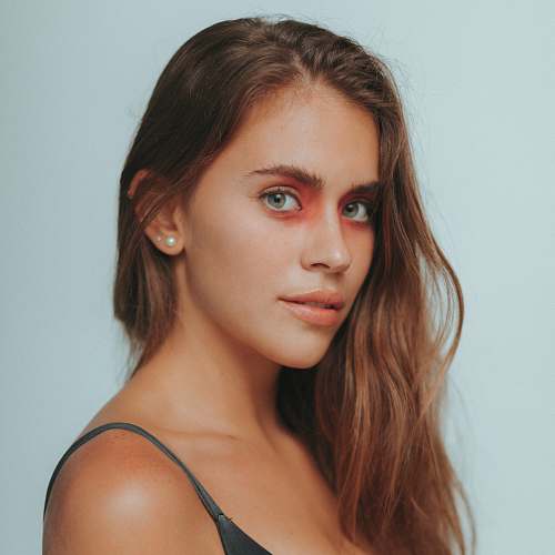 people close-up photo of a woman posing while wearing black spaghetti strap top human