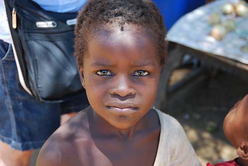people closeup photography of child wearing white top human