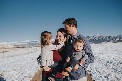people family on snow field human