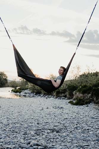 people man lying on hammock human