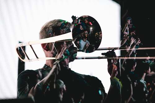 people man playing trombone with white screen background human