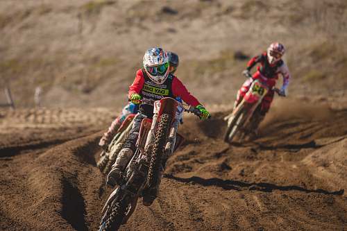 motocross man riding motocross dirt motorcycle during daytime motorcycle