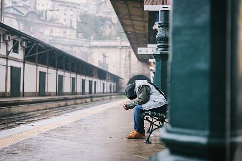 people man sitting on bench human