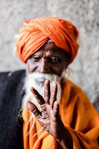 people man wearing orange turban turban