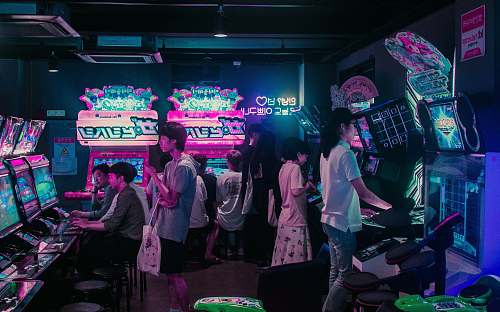 people people playing arcade games human