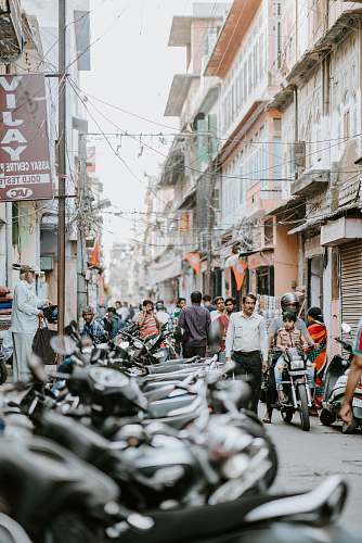people people walking on street motorcycle
