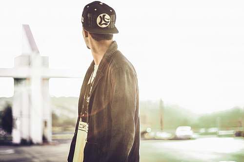 people selective focus photography of man looking left human
