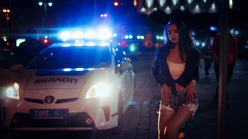 people woman beside white Toyota car human
