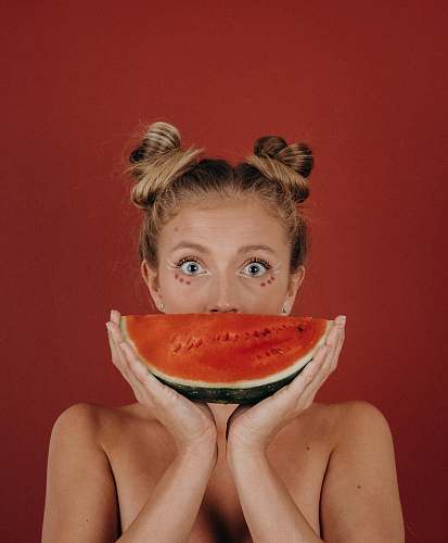 people woman covering her mouth with watermelon human