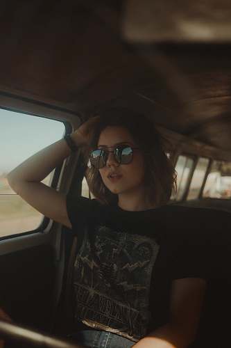 people woman holding head sitting inside vehicle human