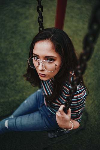 people woman sitting on swing human