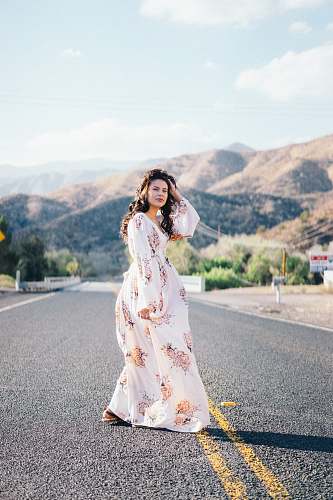 people woman standing in the middle of the road human