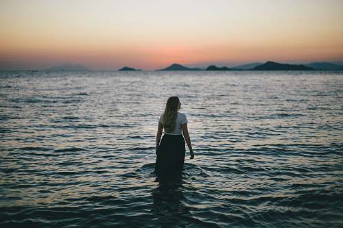 people woman walking on body of water human
