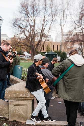 clothing man in green jacket playing violin footwear