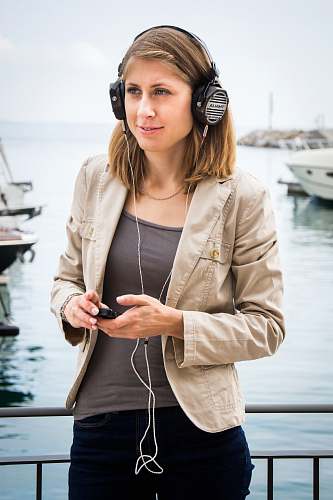 clothing woman using headphones] person