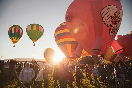 sky people near assorted-color hot air balloon during sunset nature