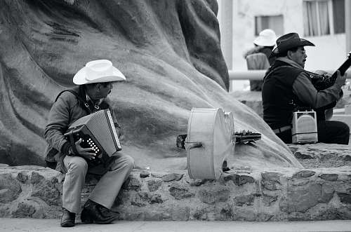 human two men playing musical instruments person