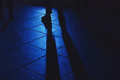 light person's shadow on floor shadow