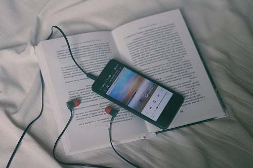 reading black smartphone on white book page calm