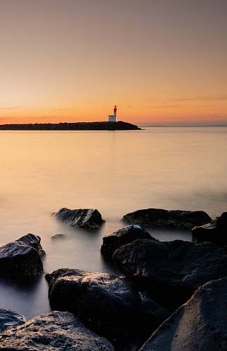 architecture rock formation on sea at daytime tower
