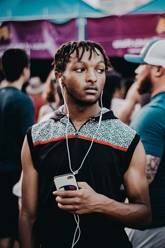 human man using earphones person