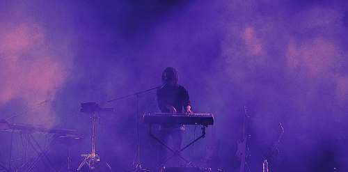 human man playing electronic keyboard person