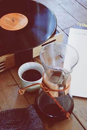 coffee clear glass coffee pitcher beside turntable coffee cup