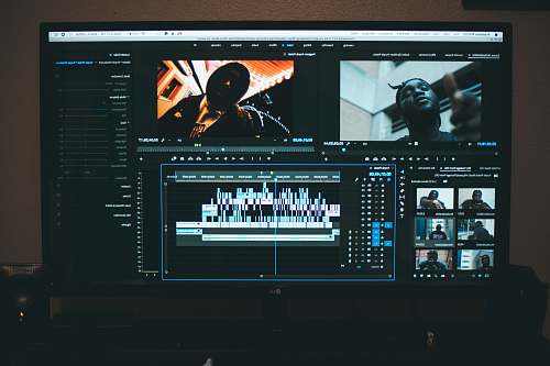 electronics man in black suit jacket monitor