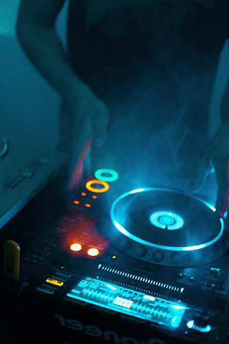 mixing person using DJ turntable turntable
