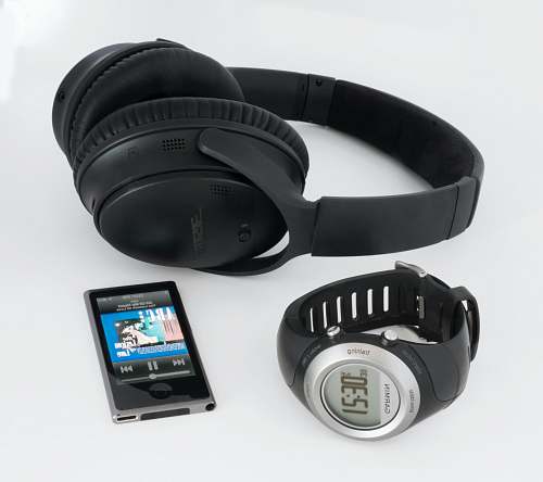 headphones black Bose wireless headphones near smartwatch and iPod cell phone