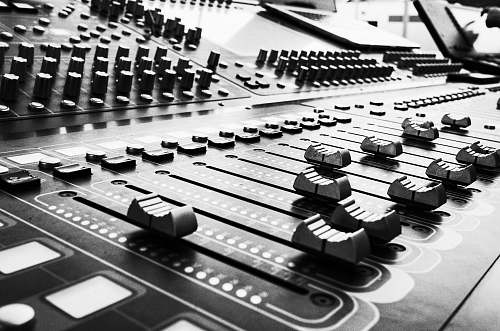 black-and-white close up photo of audio mixer console
