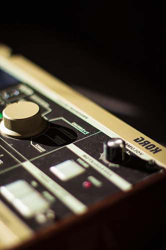 phone gray Korg music system on black background mobile phone