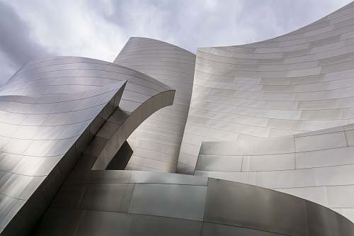 architecture architectural photography of gray building audience