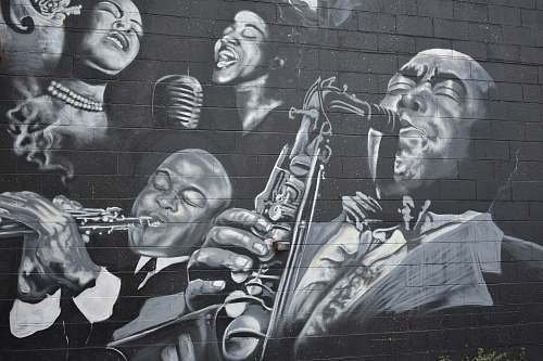 detroit grayscale photo of men playing musical instruments mural
