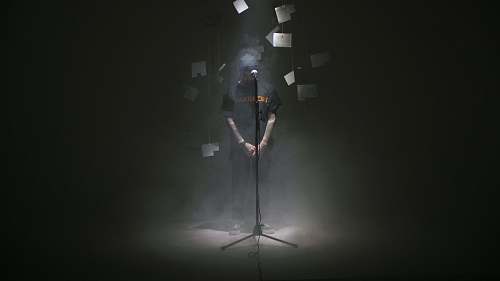 human man standing near microphone person