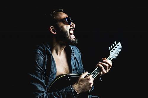 musician man playing string instrument person