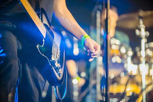 music person playing black guitar band