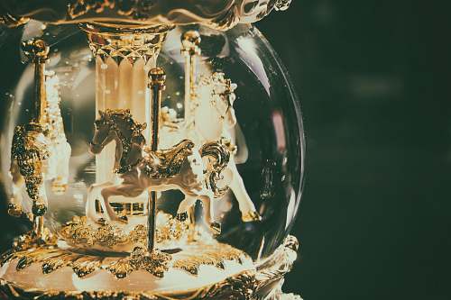 animal horse carousel snow globe mammal