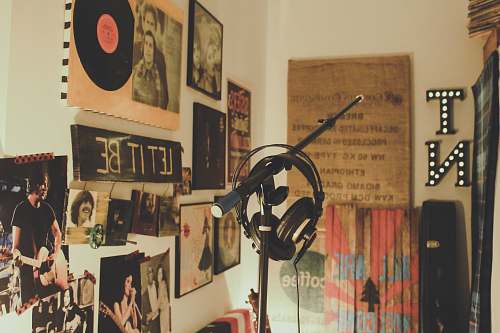 person black condenser mic with stand and headphones music