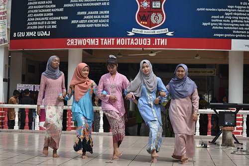 clothing five woman dancing during daytime apparel