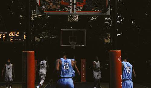 person group of men drilling in basketball cout people