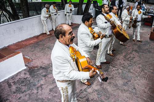 person group of musicians playing instruments on stage people