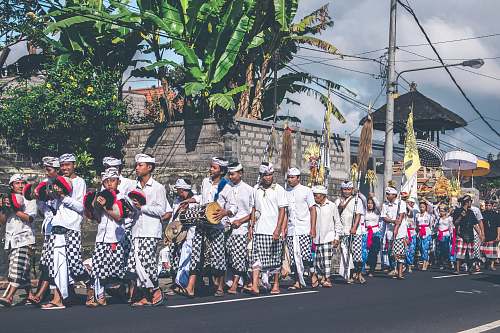 person group of people standing on road people