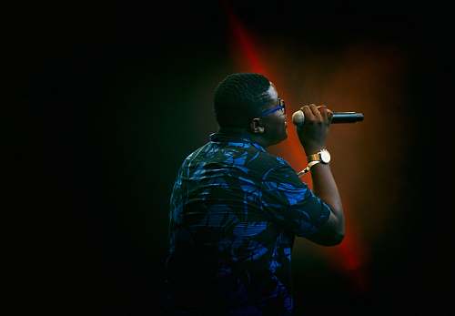 person man holding microphone rapper