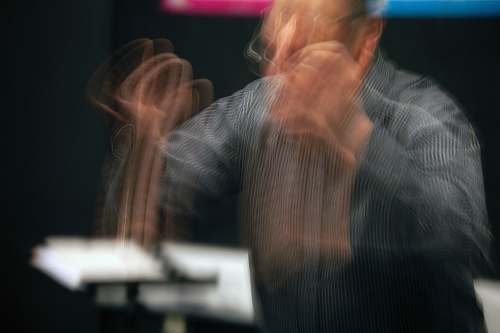 person man in long-sleeved shirt musician